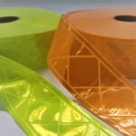 detalhe rolos de faixa refletiva para colete amarela e 1 rolo de faixa refletiva para colete laranja e amarela, faixa refletiva de PVC
