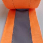 imagem detalhe do rolo de faixa refletiva para roupa laranja