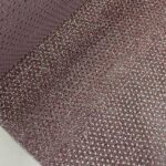 Filme de recorte PERFURADO glitter multicor visto de perto mostrando os furos